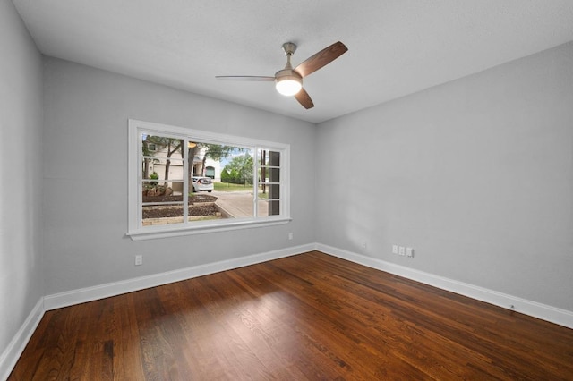 2109 W 10th St, Austin, TX 78703 - spare room featuring dark wood-type flooring and a ceiling fan