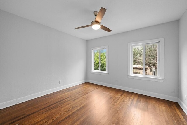 2109 W 10th St, Austin, TX 78703 - spare room featuring wood finished floors and a ceiling fan