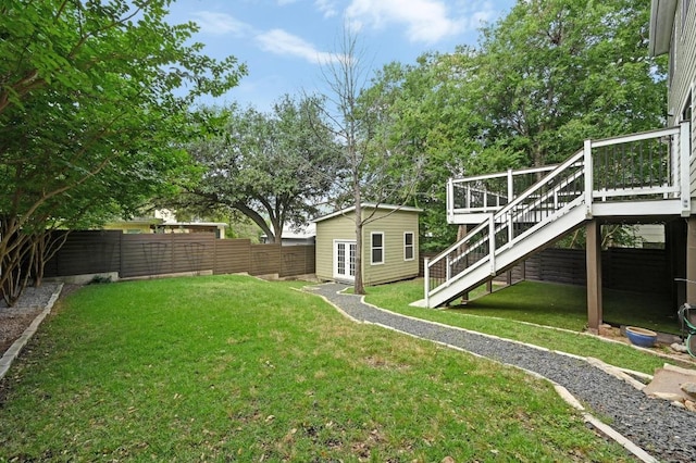 2109 W 10th St, Austin, TX 78703 - fenced yard featuring a wooden deck, stairs, and an outdoor structure