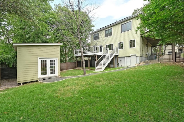 2109 W 10th St, Austin, TX 78703 - back of property featuring stairs, a wooden deck, french doors, and an outdoor structure
