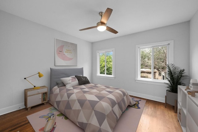 2109 W 10th St, Austin, TX 78703 - bedroom with light wood finished floors and a ceiling fan