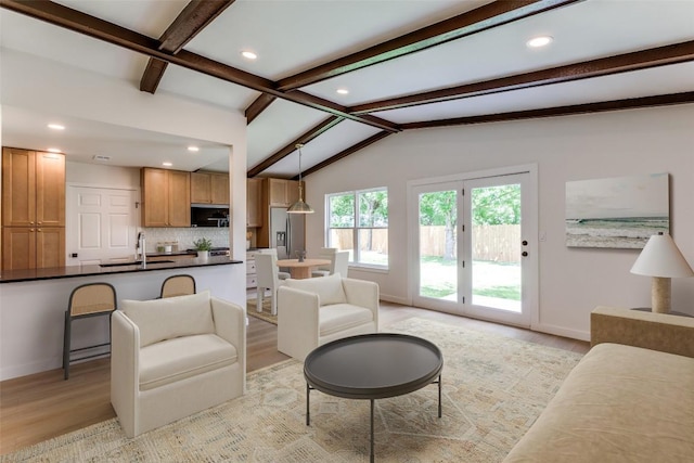 8409 Kimble Cv, Austin, TX 78757 - living room with light wood-style flooring, baseboards, and recessed lighting