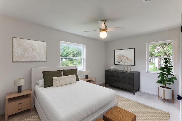8409 Kimble Cv, Austin, TX 78757 - bedroom with multiple windows, light carpet, baseboards, and ceiling fan