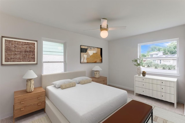 8409 Kimble Cv, Austin, TX 78757 - bedroom with light colored carpet, ceiling fan, and baseboards