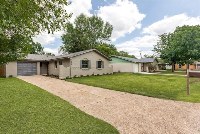 8409 Kimble Cv, Austin, TX 78757 - single story home with a garage, concrete driveway, brick siding, and a front yard
