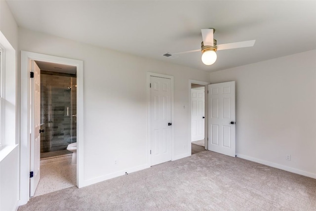 8409 Kimble Cv, Austin, TX 78757 - unfurnished bedroom with carpet floors, baseboards, a closet, connected bathroom, and ceiling fan