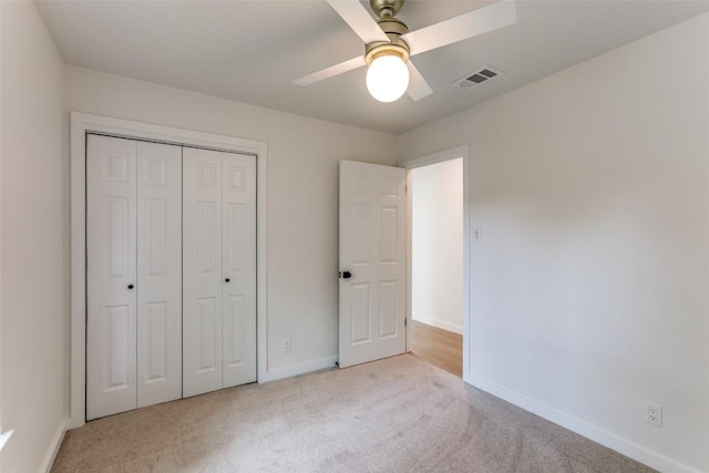 8409 Kimble Cv, Austin, TX 78757 - unfurnished bedroom featuring carpet floors, a closet, and ceiling fan