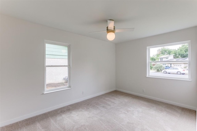 8409 Kimble Cv, Austin, TX 78757 - unfurnished room featuring light colored carpet, a ceiling fan, and baseboards
