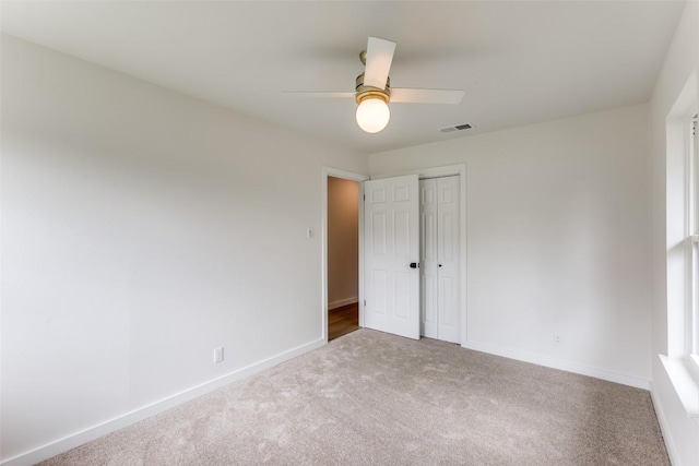 8409 Kimble Cv, Austin, TX 78757 - unfurnished bedroom with carpet, a closet, baseboards, and ceiling fan