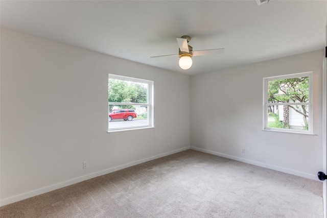 8409 Kimble Cv, Austin, TX 78757 - unfurnished room featuring light colored carpet, baseboards, and ceiling fan