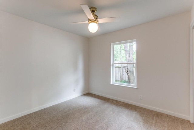 8409 Kimble Cv, Austin, TX 78757 - unfurnished room with light colored carpet, baseboards, and a ceiling fan
