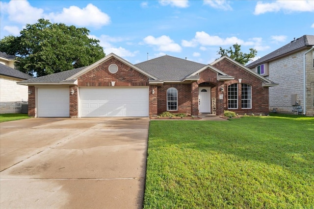 1509 Foster Dr, Cedar Park, TX 78613 - view of front of house featuring driveway, a front yard, an attached garage, brick siding, and roof with shingles