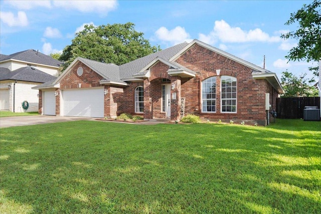1509 Foster Dr, Cedar Park, TX 78613 - view of front of house featuring brick siding, an attached garage, central AC, and concrete driveway