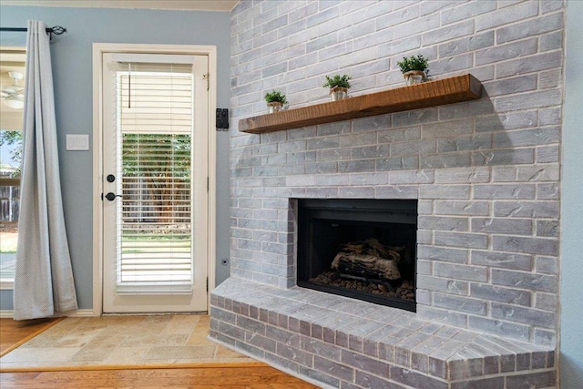 1509 Foster Dr, Cedar Park, TX 78613 - detailed view of a brick fireplace and baseboards