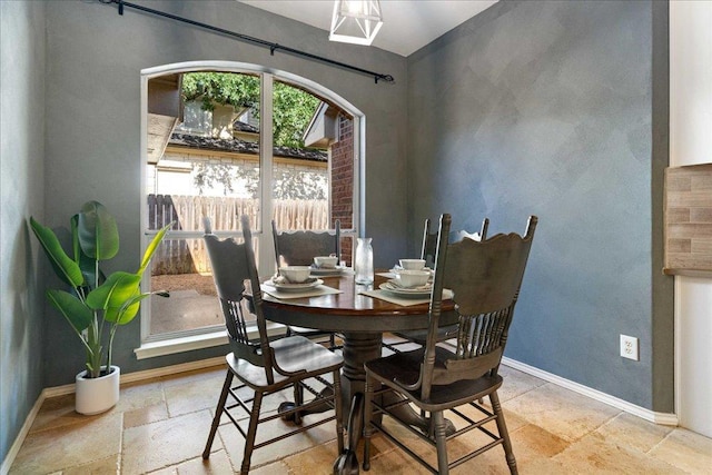 1509 Foster Dr, Cedar Park, TX 78613 - dining area with baseboards and stone tile flooring
