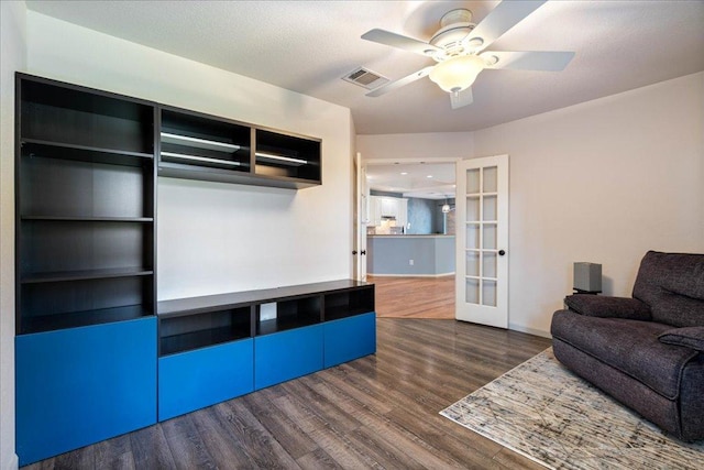 1509 Foster Dr, Cedar Park, TX 78613 - living area with french doors, dark wood-type flooring, a ceiling fan, and baseboards