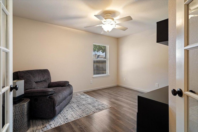1509 Foster Dr, Cedar Park, TX 78613 - living area with wood finished floors, a ceiling fan, and baseboards