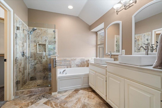 1509 Foster Dr, Cedar Park, TX 78613 - bathroom with a garden tub, vanity, a shower stall, and vaulted ceiling