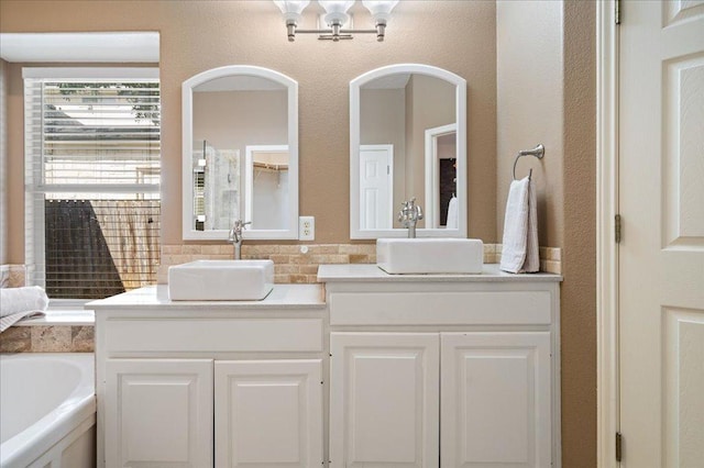 1509 Foster Dr, Cedar Park, TX 78613 - full bathroom with double vanity and a bath