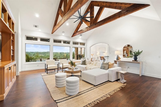 321 Hannah Dr, Dripping Springs, TX 78620 - living room featuring high vaulted ceiling, beam ceiling, arched walkways, hardwood / wood-style flooring, and baseboards