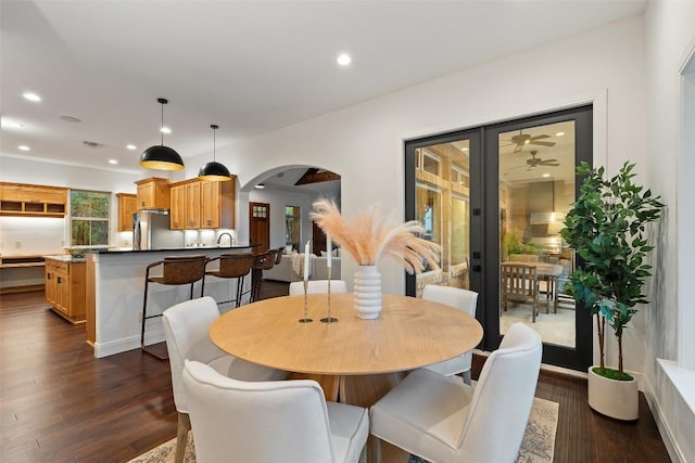 321 Hannah Dr, Dripping Springs, TX 78620 - dining area with arched walkways, dark wood-style floors, and recessed lighting
