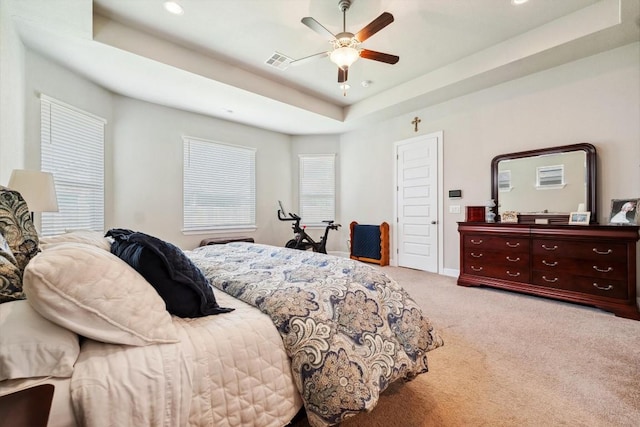1005 Hezekiah Ln, Leander, TX 78641 - carpeted bedroom featuring a tray ceiling, recessed lighting, and ceiling fan