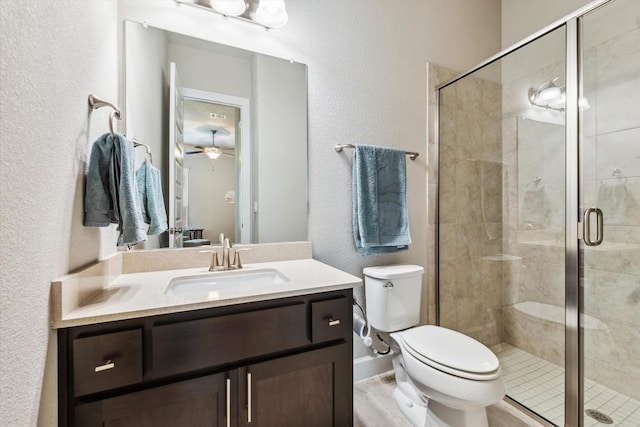 1005 Hezekiah Ln, Leander, TX 78641 - full bathroom featuring a textured wall, vanity, a stall shower, and a ceiling fan