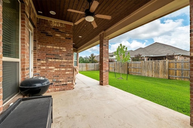 1005 Hezekiah Ln, Leander, TX 78641 - fenced backyard featuring a ceiling fan, a patio, and grilling area