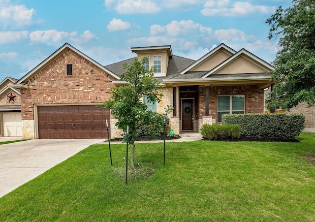 1005 Hezekiah Ln, Leander, TX 78641 - view of front of home featuring a front yard, a garage, driveway, and brick siding