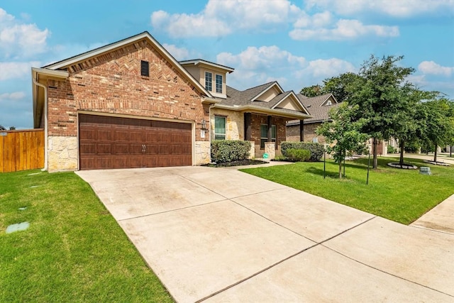 1005 Hezekiah Ln, Leander, TX 78641 - traditional-style house featuring concrete driveway, a garage, stone siding, and brick siding