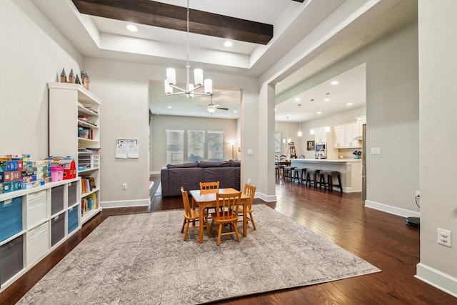 1005 Hezekiah Ln, Leander, TX 78641 - dining space with a chandelier, dark wood-style floors, recessed lighting, a raised ceiling, and ceiling fan