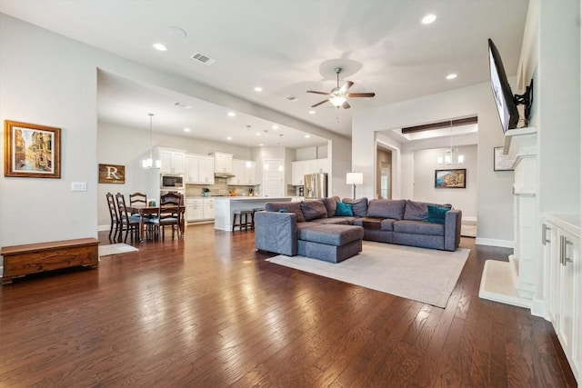 1005 Hezekiah Ln, Leander, TX 78641 - living room featuring a ceiling fan, dark wood-style floors, and recessed lighting