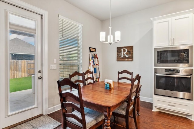 1005 Hezekiah Ln, Leander, TX 78641 - dining area featuring a chandelier and dark wood-type flooring