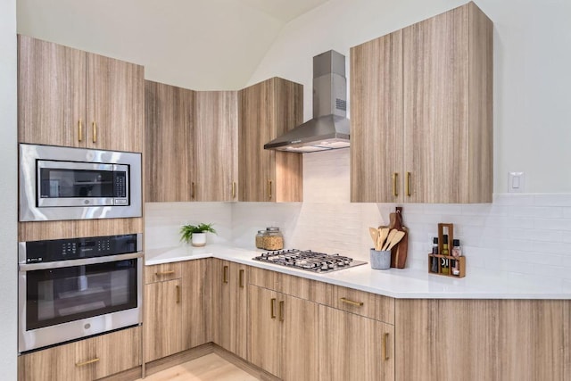 9124 Fainwood Ln, Austin, TX 78749 - kitchen with stainless steel appliances, wall chimney range hood, modern cabinets, light countertops, and decorative backsplash