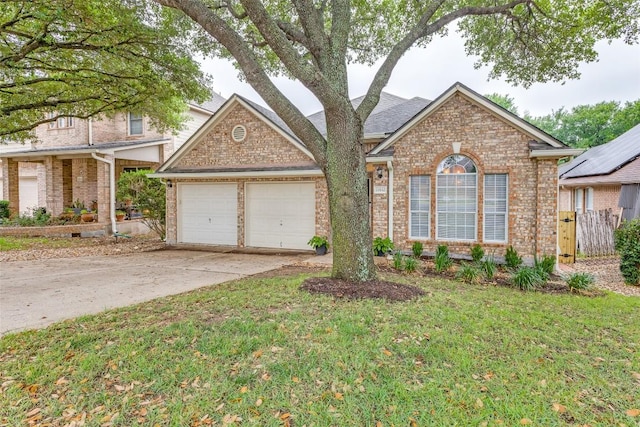 13532 Utah Flats Dr, Austin, TX 78727 - traditional-style house with an attached garage, brick siding, and concrete driveway