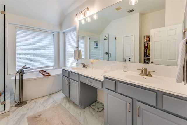 13532 Utah Flats Dr, Austin, TX 78727 - full bathroom featuring lofted ceiling, a shower stall, double vanity, a soaking tub, and a spacious closet