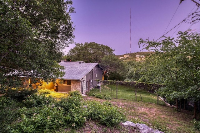 907 The High Rd, Austin, TX 78746 - view of yard at dusk