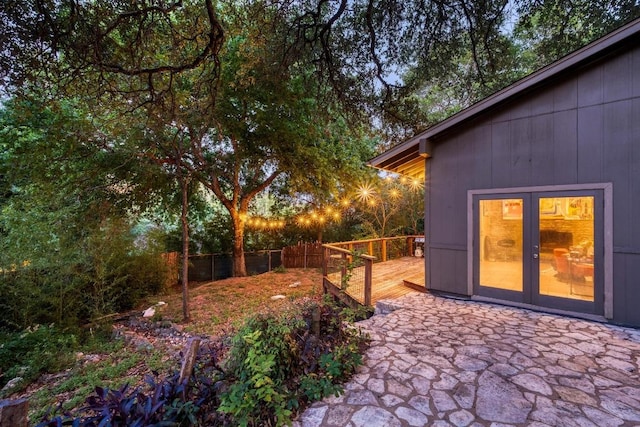 907 The High Rd, Austin, TX 78746 - view of yard featuring a deck and french doors
