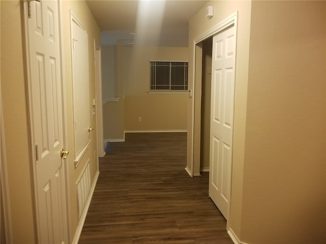 1516 Anise Dr, Austin, TX 78741 - hall with dark wood-style flooring and baseboards