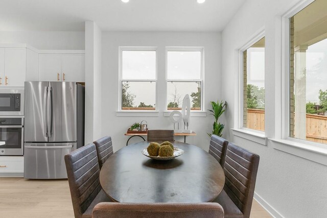 2705 Sage Ranch Dr Unit 2, Leander, TX 78641 - dining space with healthy amount of natural light, light wood-type flooring, recessed lighting, and baseboards