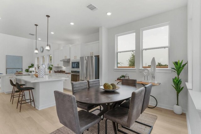 2705 Sage Ranch Dr Unit 2, Leander, TX 78641 - dining space with light wood-style floors, recessed lighting, and baseboards