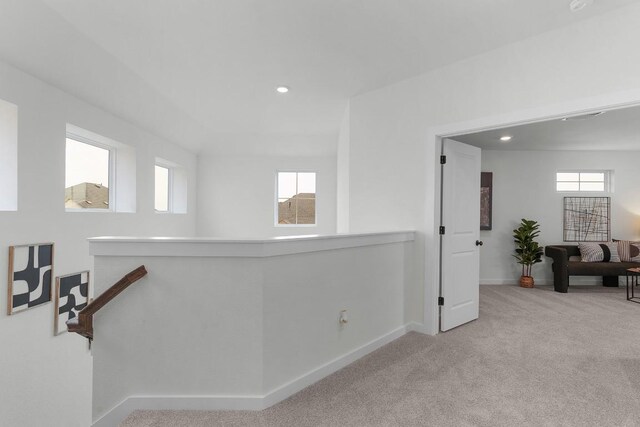 2705 Sage Ranch Dr Unit 2, Leander, TX 78641 - hallway with baseboards, plenty of natural light, carpet floors, an upstairs landing, and recessed lighting