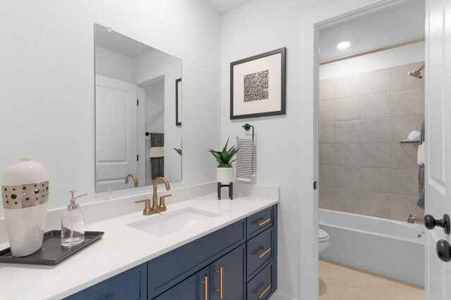 2705 Sage Ranch Dr Unit 2, Leander, TX 78641 - full bathroom featuring vanity, toilet, washtub / shower combination, and tile patterned floors