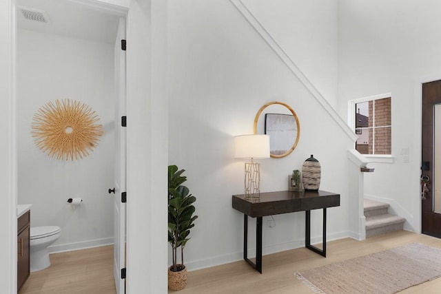 2705 Sage Ranch Dr Unit 2, Leander, TX 78641 - hall featuring light wood-style flooring, stairway, and baseboards