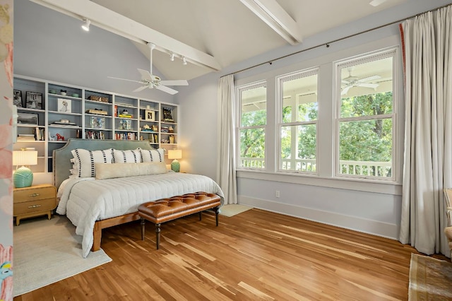 800 W Lynn St, Austin, TX 78703 - bedroom featuring rail lighting, wood finished floors, baseboards, and a ceiling fan