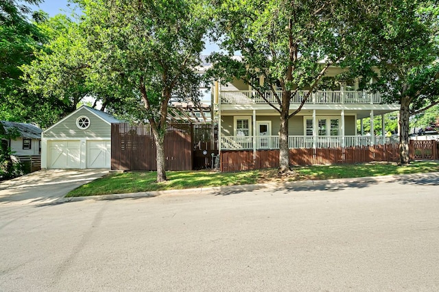 800 W Lynn St, Austin, TX 78703 - view of front of property with a garage, a balcony, and concrete driveway