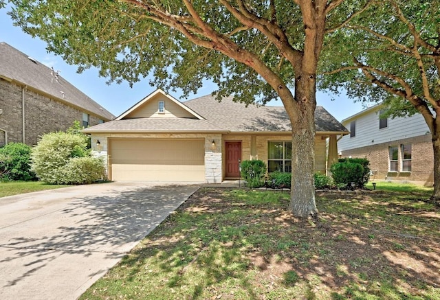 1286 Talley Loop, Buda, TX 78610 - traditional home with an attached garage, a shingled roof, and concrete driveway