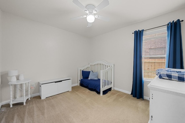 1286 Talley Loop, Buda, TX 78610 - bedroom with light carpet, baseboards, and ceiling fan