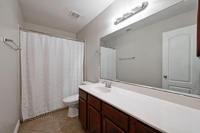 1286 Talley Loop, Buda, TX 78610 - full bathroom featuring vanity, toilet, tile patterned flooring, and a shower with curtain