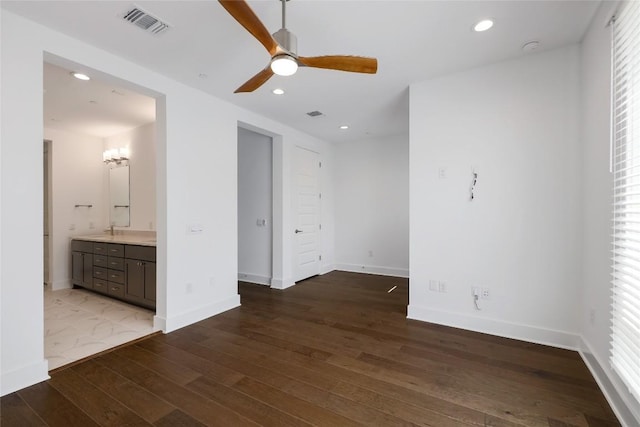 4703 Unity Cir Unit 284, Austin, TX 78731 - empty room with hardwood / wood-style floors, a ceiling fan, baseboards, recessed lighting, and a sink
